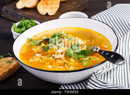 Red lentil soup with chicken meat and vegetables close-up on the table. Healthy food. Stock Photo