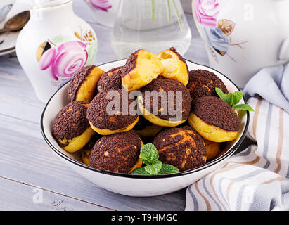 Shu Cake. Tasty profiterole with cream on the plate. Copy space Stock Photo