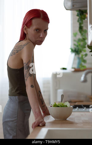 Woman looking miserable while suffering from anorexia Stock Photo