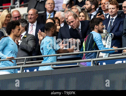 London, UK. 18th May, 2019. Raheem Sterling of Manchester City receives his winners medal Prince William, Duke of Cambridge during the FA CUP FINAL match between Manchester City and Watford at Wembley Stadium, London, England on 18 May 2019. Photo by Andy Rowland. Credit: PRiME Media Images/Alamy Live News Stock Photo