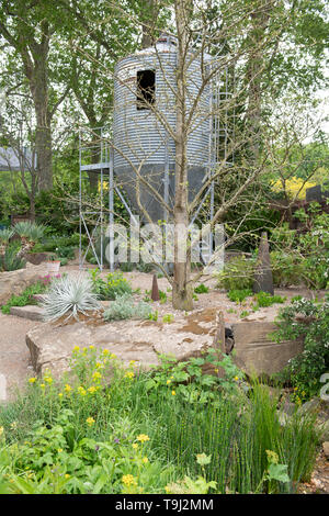 Royal Hospital Chelsea, London, UK. 19th May 2019. Chelsea Flower Show 2019 readies itself for judges with public opening on 21st May, with finishing touches to outdoor gardens. Image: The Resilience Garden, 100 years of forestry 1919-2019, designed by Sarah Eberle. Credit: Malcolm Park/Alamy Live News. Stock Photo