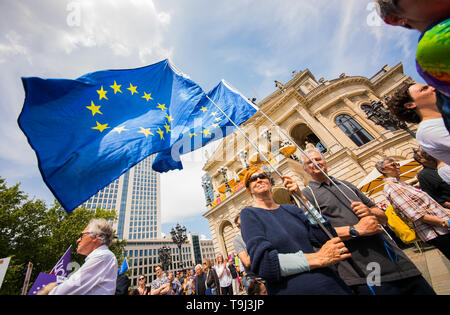 Frankfurt, Germany. 19th May, 2019.  Participants of the rally for Europe hold EU flags on the Opera Square. Under the motto 'A Europe for All - Your Voice Against Nationalism', more than 150 organisations in Germany and European cities are calling for demonstrations. Photo: Andreas Arnold/dpa Credit: dpa picture alliance/Alamy Live News Stock Photo