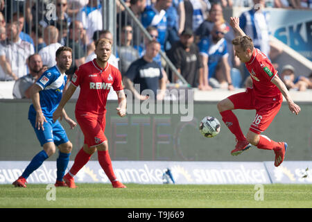 Magdeburg, Germany. 19th May, 2019. Soccer: 2nd Bundesliga, 1st FC Magdeburg - 1st FC Cologne, 34th matchday in the MDCC-Arena. Cologne's Niklas Hauptmann (r) accepts the ball. Credit: Swen Pförtner/dpa - IMPORTANT NOTE: In accordance with the requirements of the DFL Deutsche Fußball Liga or the DFB Deutscher Fußball-Bund, it is prohibited to use or have used photographs taken in the stadium and/or the match in the form of sequence images and/or video-like photo sequences./dpa/Alamy Live News Stock Photo