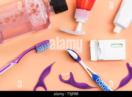 Dental care products like toothbrush, dental floss and other on the white background, top view Stock Photo