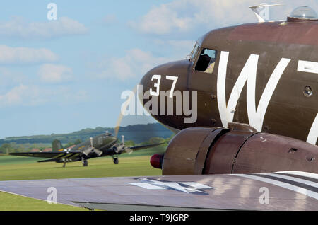 DC-3 Dakotas in period camouflage markings - including D Day 'invasion stripes'. Second World War transport troop carrying planes Stock Photo