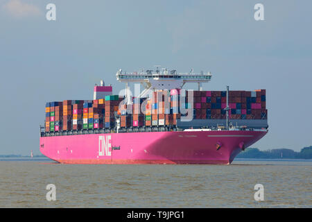 Stade, Germany - May 18, 2019: Ultra-large Container Ship ONE Columba on Elbe river heading to Hamburg. The vessel is operated by Ocean Network Express Stock Photo