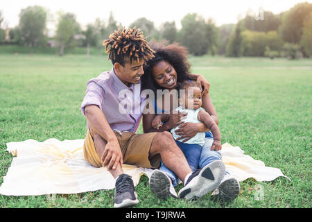 Premium Photo  Cheerful young black family in sportswear doing