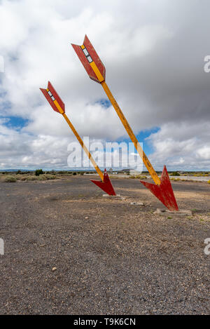 Twin arrows mark the exit for this abandoned gas station on Route 66 Stock Photo