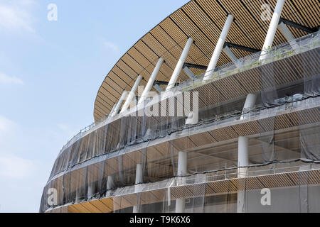 Construction Site Of New National Stadium In Tokyo. Japan Is Preparing For New Olympic Games. Tree Arrangement On The Facade Of Building. Stock Photo