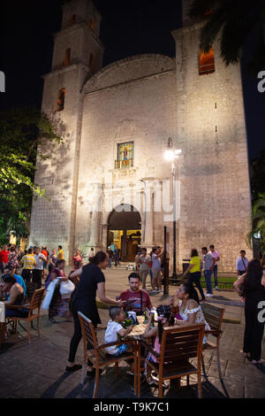 Mexico travel - people eating at restaurants outdoors at night, street scene; Merida, Yucatan, Mexico Latin America Stock Photo