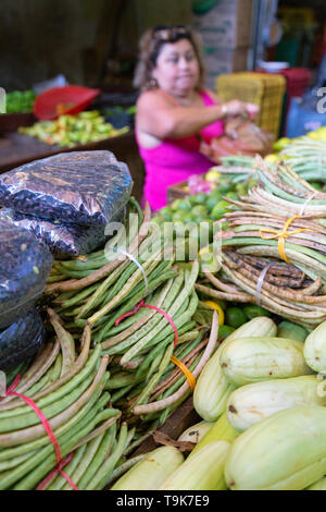 Mexican market - a local woman buying food at a market stall, Merida Yucatan Mexico Latin America Stock Photo