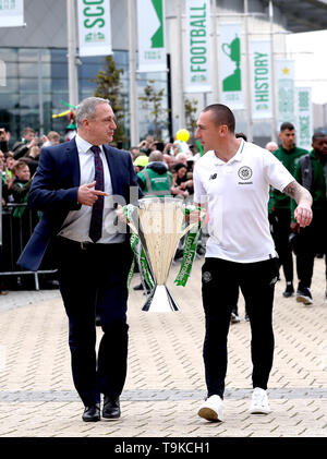 Former Celtic player Paul McStay (left) and Celtic's Scott Brown take the Ladbrokes Scottish Premiership cup trophy up to the stadium prior to the beginning of the Ladbrokes Scottish Premiership match at Celtic Park, Glasgow. Stock Photo