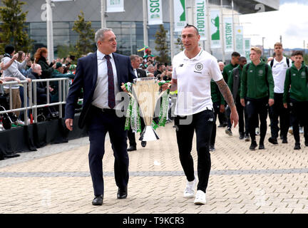 Former Celtic player Paul McStay (left) and Celtic's Scott Brown take the Ladbrokes Scottish Premiership cup trophy up to the stadium prior to the beginning of the Ladbrokes Scottish Premiership match at Celtic Park, Glasgow. Stock Photo