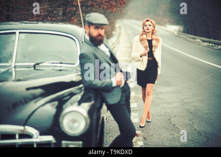 taxi on road with luxury couple. taxi driver and woman at retro car. Stock Photo