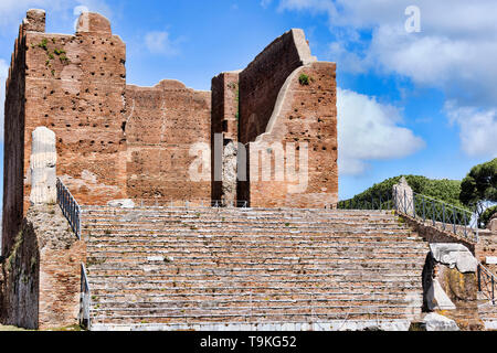 The Capitolium at archaeological excavations of Ostia Antica surrounded by ruins, columns and remains of statues and bas-reliefs Stock Photo