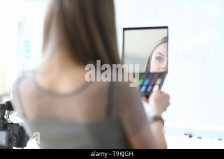 Female Beauty Blogger Cosmetic Product Review Stock Photo