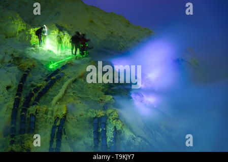 Blue Flame in Sulfur mining at night, Kawah Ijen volcano, East Java, Indonesian. Stock Photo