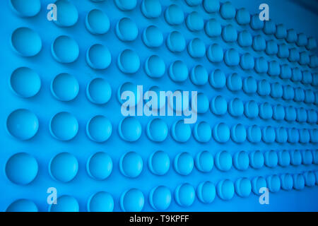 Abstract blue background. Sucker close up. Pattern of plastic cups. Stock Photo