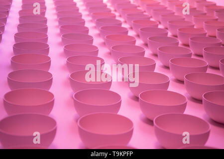 Abstract pink background. Sucker close up. Pattern of plastic cups. Stock Photo