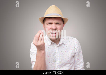 Man doing a typical italian gesture, blaming you Stock Photo