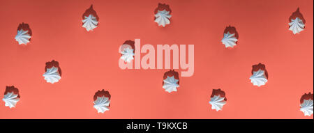 minimalistic pattern of meringue with a hard shadow on a colored background Stock Photo