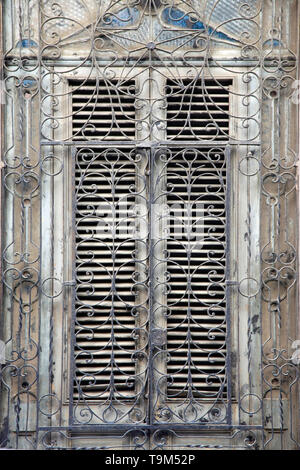 Wooden old window with iron bars Stock Photo