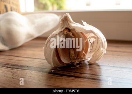 half a garlic bulb peeled and ready to use Stock Photo