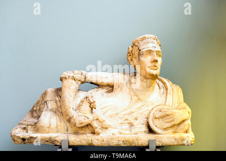 Alabaster lid of a cinerary urn with a figure of a reclining man Etruscan, 200-100 BC Probably from Volterra Stock Photo
