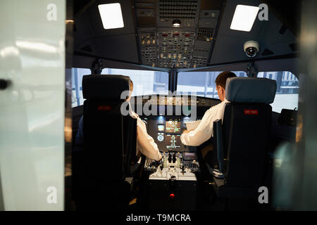 Pilots in airplane cockpit Stock Photo