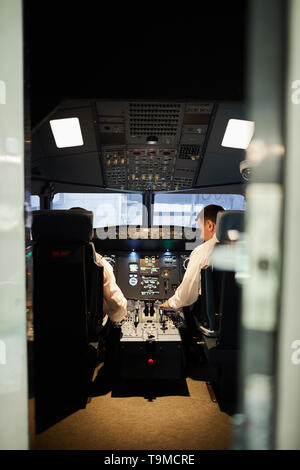 Pilots in cabin Stock Photo