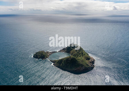 Aerial image of the idyllic islet of Vila Franca do Campo (Ilhéu de Vila Franca) with the Atlantic ocean in the background.   This is a tiny islet jus Stock Photo