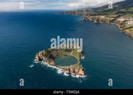 Aerial image of the idyllic islet of Vila Franca do Campo (Ilhéu de Vila Franca) with the coastline of Caloura on the background.   This is a tiny isl Stock Photo