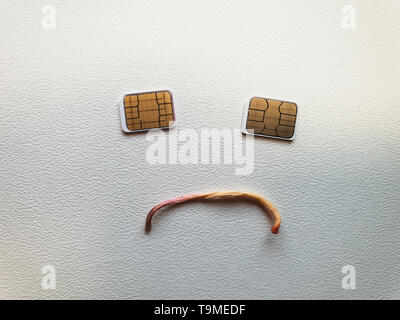 two micro sim cards lying in the shape of a smiling face Stock Photo ...