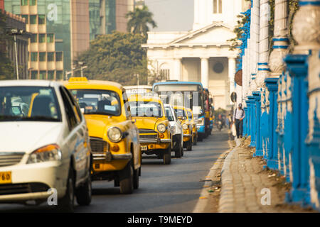 Street traffic with taxi and cars on the streets of Kolkata, India. Stock Photo