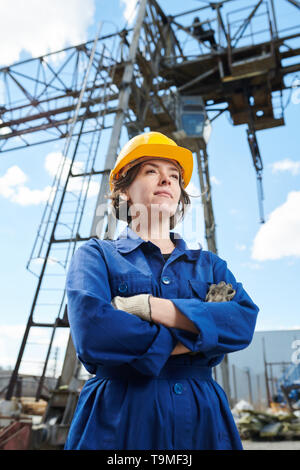 Smiling Woman at Construction Site Stock Photo