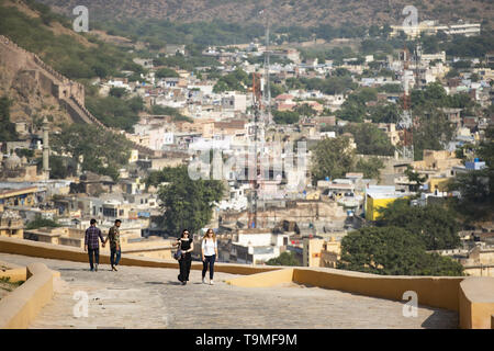 Some tourists are walking and admiring the Amber Fort (Amer Fort) in Amer, Jaipur, Rajasthan, India. Stock Photo