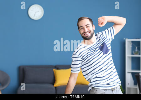 Handsome young man dancing at home Stock Photo