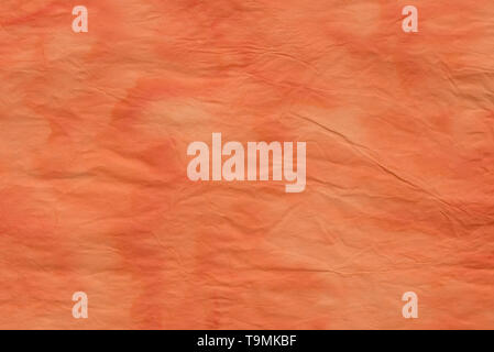 orange color creased paper tissue background texture Stock Photo