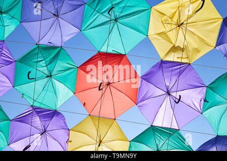 The image of colorful umbrellas on a background of blue sky Stock Photo