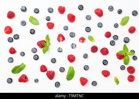 Fresh summer berries flat lay. Blueberries, raspberries and mint leaf pattern. Top view Stock Photo