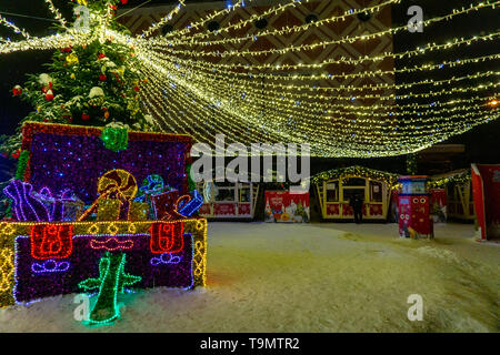 Big gift box decorated and lighted for Christmas and for New Year Eve of 2019
