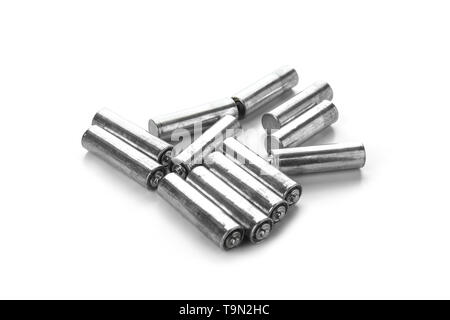 Used batteries on white background. Recycling concept Stock Photo