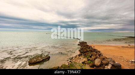 Dramatic landscape of Chipiona beach, in the province of Cadiz, Spain, on a cloudy day Stock Photo