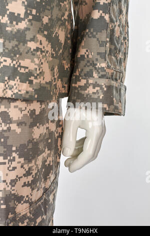 Left mannequins hand in military uniform. Stock Photo