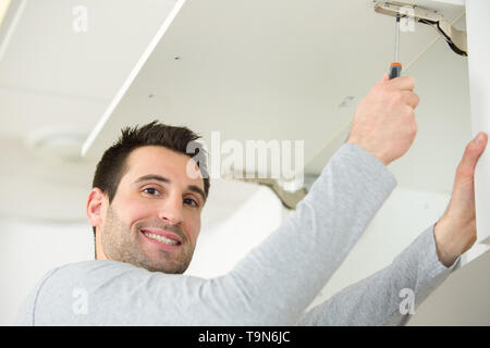 carpenter working on new kitchen Stock Photo