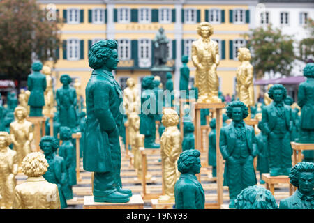 Bonn, Deutschland. 17th May, 2019. 700 Ludwig van Beethoven sculptures stand on Bonn's Muensterplatz in front of the historic Beethoven monument. The sculptures were created by Prof. dr. Ottmar Hoerl (Horl) designed. A public action on the upcoming 250th birthday of Ludwig van Beethoven; on 17.05.2019 in Bonn/Germany. | usage worldwide Credit: dpa/Alamy Live News Stock Photo