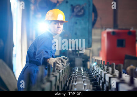 Female Worker at Production Plant Stock Photo