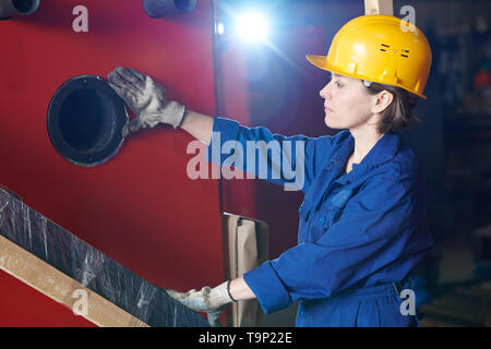 Young Woman Working at Plant Stock Photo