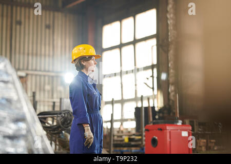 Female Worker Side View Stock Photo