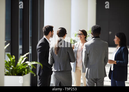 Positive business team discussing ideas Stock Photo